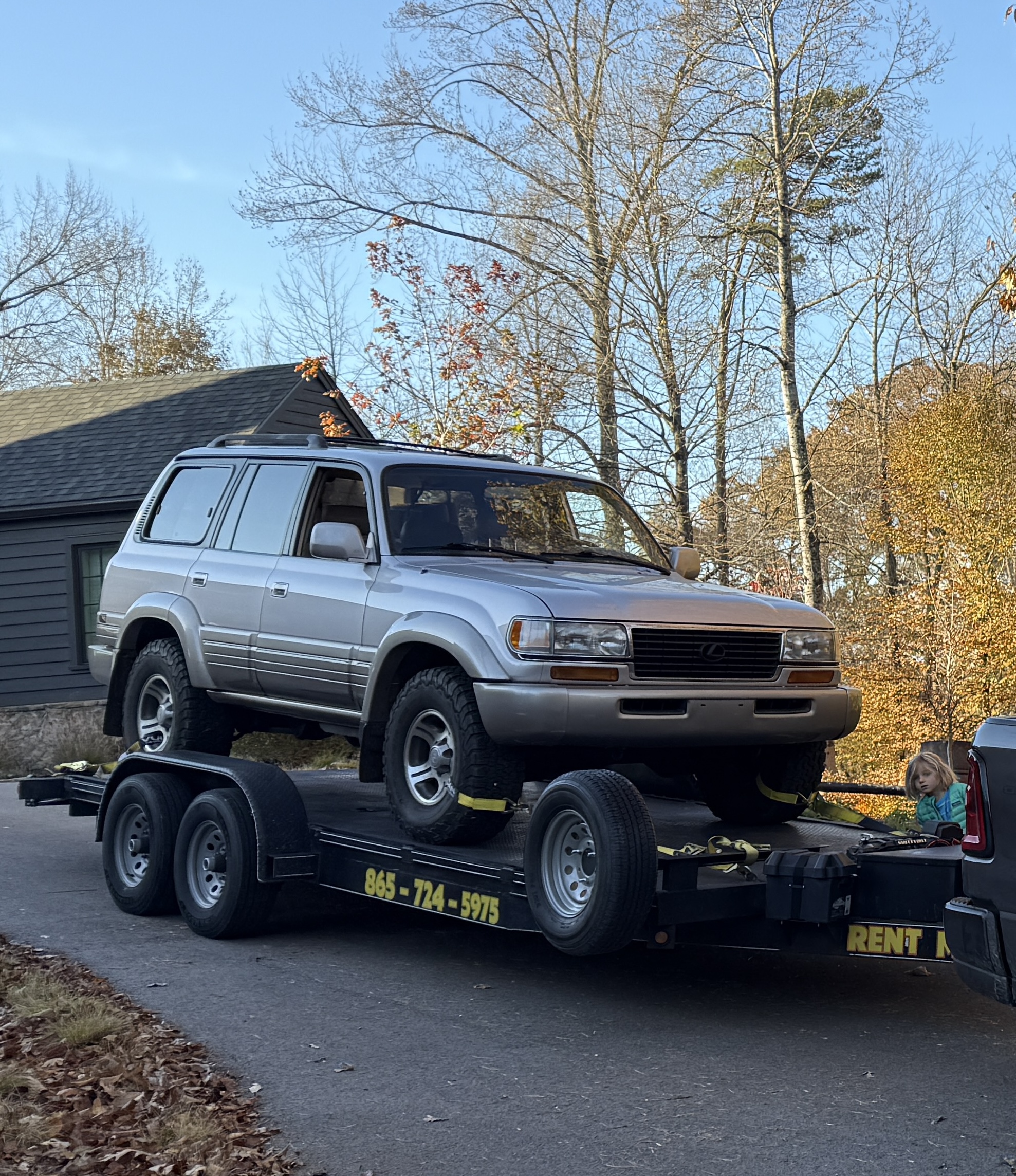 Silver SUV loaded on Trailblazer car hauler trailer with RENT ME branding - 845-724-5975
